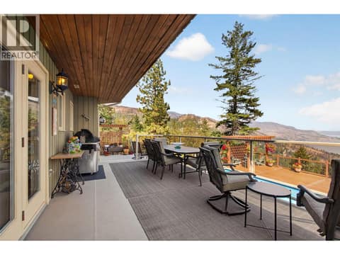 Partially covered patio accessed from the dining room or media room at 1776 Keloka Drive, West Kelowna Estates
