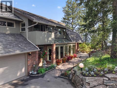 Pathway leads to the front door & side yard at 1776 Keloka Drive, West Kelowna Estates