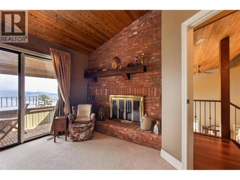 Second bedroom fireplace at 1776 Keloka Drive, West Kelowna Estates