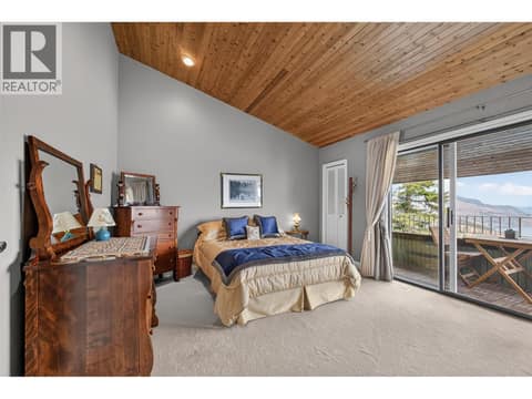 Second bedroom with private fire place & patio at 1776 Keloka Drive, West Kelowna Estates