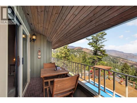 Second bedroom with private fire place & patio at 1776 Keloka Drive, West Kelowna Estates