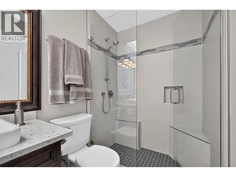 Second full bathroom on the upper level with a sky light at 1776 Keloka Drive, West Kelowna Estates