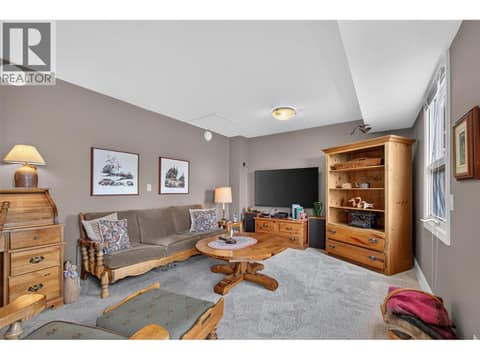 Sitting/TV room on the main level at 1776 Keloka Drive, West Kelowna Estates