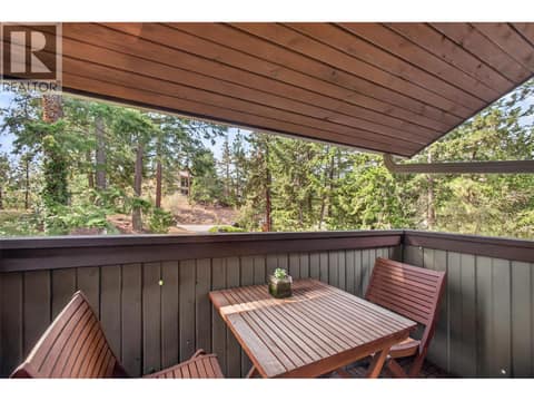 Third bedroom with it's own patio facing the trees at 1776 Keloka Drive, West Kelowna Estates