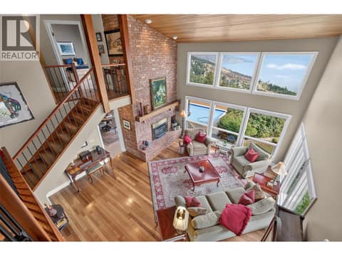 Vaulted ceilings throughout  the main space with large windows at 1776 Keloka Drive, West Kelowna Estates