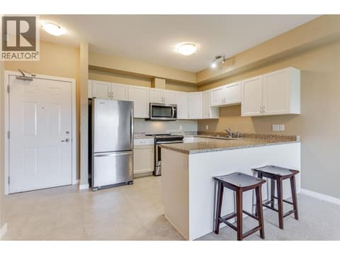 Bright modern cabinetry and stainless steel appliances at 770 Rutland Road N Unit# 401, Rutland North, Kelowna
