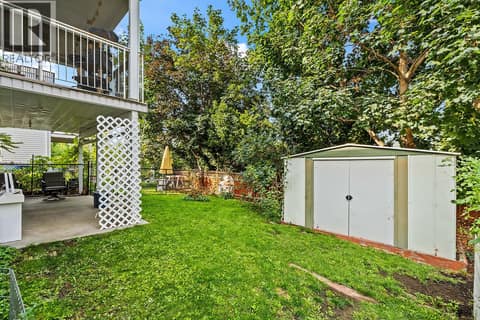 Backyard with Patio, Shed, and Fully-Fenced Yard at 6100 Old Vernon Road Unit# 30, Ellison, Kelowna