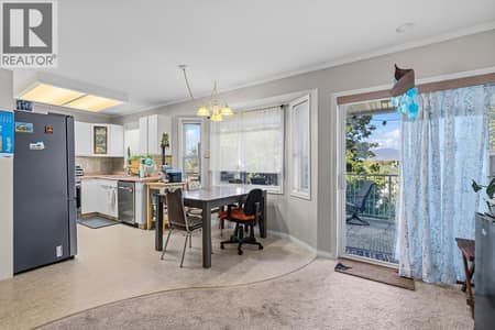 Kitchen and Dining Room with access to the Balcony at 6100 Old Vernon Road Unit# 30, Ellison, Kelowna