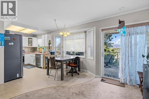 Kitchen and Dining Room with access to the Balcony at 6100 Old Vernon Road Unit# 30, Ellison, Kelowna