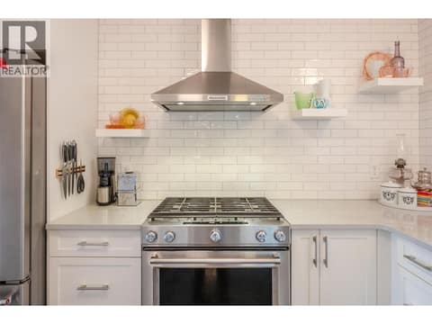 Main floor kitchen. at 127 Elm Avenue, Main South, Penticton