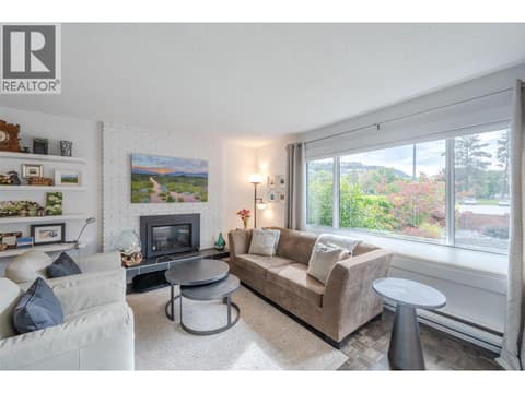 Main floor living room. at 127 Elm Avenue, Main South, Penticton