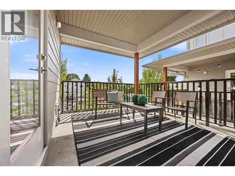 A second covered patio lets you enjoy outdoor living on both sides of the home. at 255 Taylor Road Unit# 18, Rutland South, Kelowna