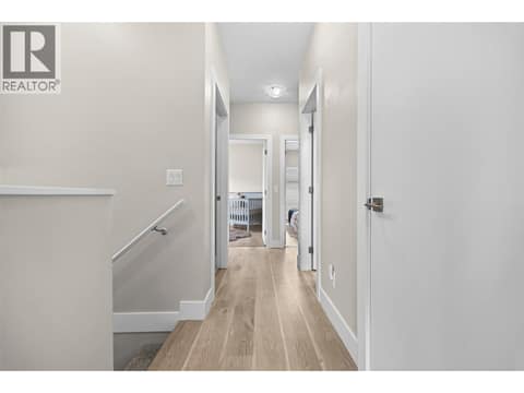 All three bedrooms are conveniently located together on the upper level. at 255 Taylor Road Unit# 18, Rutland South, Kelowna