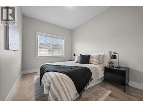 Bright and spacious secondary bedroom with a large window and generous proportions. at 255 Taylor Road Unit# 18, Rutland South, Kelowna