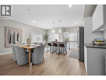 Bright, spacious layout connects the kitchen, dining and living areas. at 255 Taylor Road Unit# 18, Rutland South, Kelowna