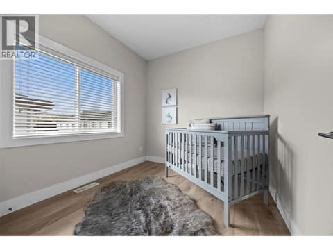 Bright third bedroom with a large window and plenty of flexibility for a nursery, child’s room or office. at 255 Taylor Road Unit# 18, Rutland South, Kelowna
