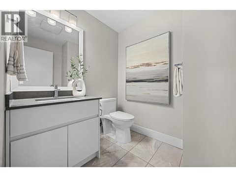 Convenient main-floor powder room with contemporary finishes. at 255 Taylor Road Unit# 18, Rutland South, Kelowna
