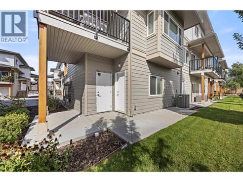 Enjoy the added privacy of this end-unit location, with a landscaped green space and patio area alongside the home. at 255 Taylor Road Unit# 18, Rutland South, Kelowna