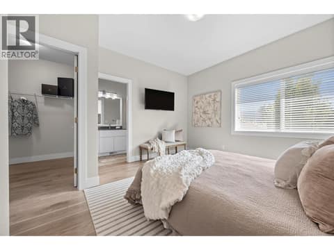 Generous primary suite with walk-in closet and private ensuite. at 255 Taylor Road Unit# 18, Rutland South, Kelowna