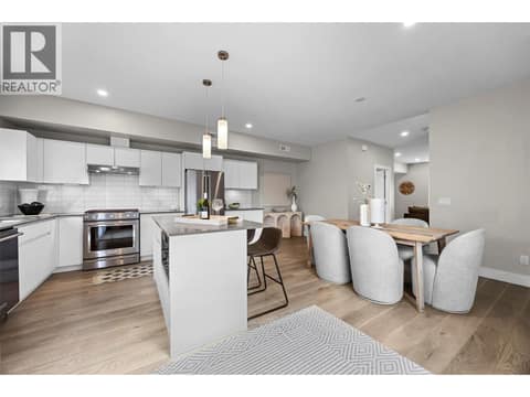Kitchen and dining areas flow seamlessly together for everyday living and entertaining. at 255 Taylor Road Unit# 18, Rutland South, Kelowna