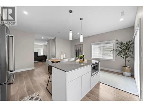 Large 3' x 6' island provides additional storage, prep space and casual seating. at 255 Taylor Road Unit# 18, Rutland South, Kelowna