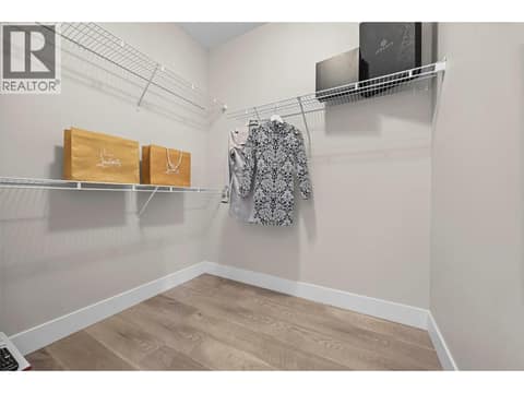 Large walk-in closet offers plenty of room for clothing and additional storage. at 255 Taylor Road Unit# 18, Rutland South, Kelowna