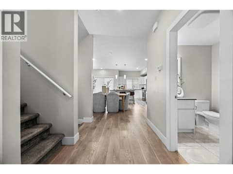 Open-concept main floor with convenient powder room just off the entry. at 255 Taylor Road Unit# 18, Rutland South, Kelowna