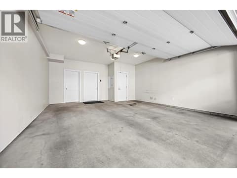 Spacious private double garage with direct access to the home and plenty of room for vehicles, bikes and additional storage. at 255 Taylor Road Unit# 18, Rutland South, Kelowna