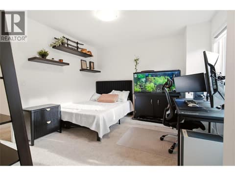 2nd bedroom with spacious walk-in closet. Upper level at 1215 Ponds Avenue, Upper Mission, Kelowna