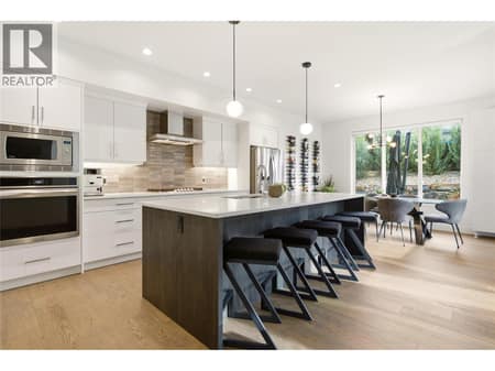 Kitchen with spacious island & barstool seating- main floor at 1215 Ponds Avenue, Upper Mission, Kelowna