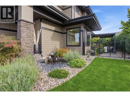 Landscaped yard/ right side of home at 1215 Ponds Avenue, Upper Mission, Kelowna