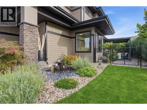 Landscaped yard/ right side of home at 1215 Ponds Avenue, Upper Mission, Kelowna