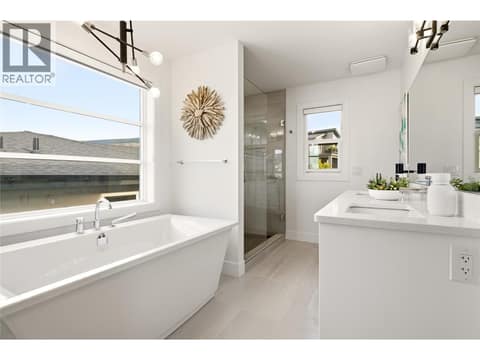 Primary bedroom- 5 piece bathroom plus spacious walk in closet at 1215 Ponds Avenue, Upper Mission, Kelowna