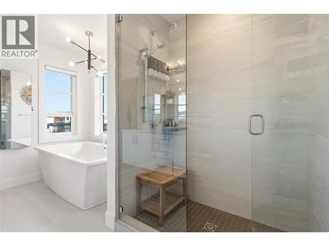Primary bedroom- glass enclosed shower at 1215 Ponds Avenue, Upper Mission, Kelowna