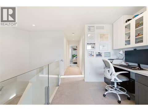 Upper level landing- office area with built in cabinetry at 1215 Ponds Avenue, Upper Mission, Kelowna