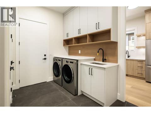 Main level laundry and mud room at 979 Loseth Drive, Black Mountain, Kelowna