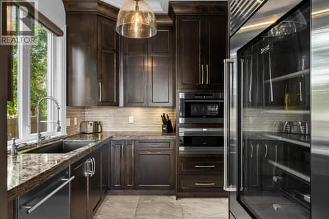 Butlers pantry - essentially a second kitchen ensuite with a subzero fridge and freezer, second sink and dishwasher and Wolf Double Wall Oven at 4165 Gellatly Road, Westbank Centre, West Kelowna