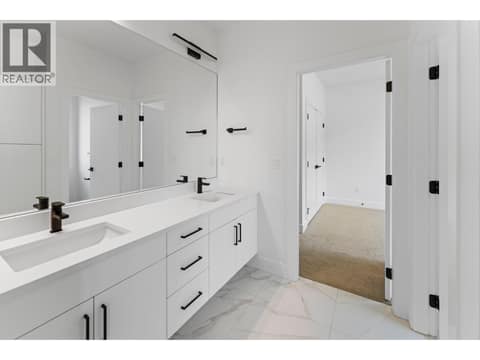 Jack and jill bathroom at 2871 Copper Ridge Drive, Smith Creek, West Kelowna