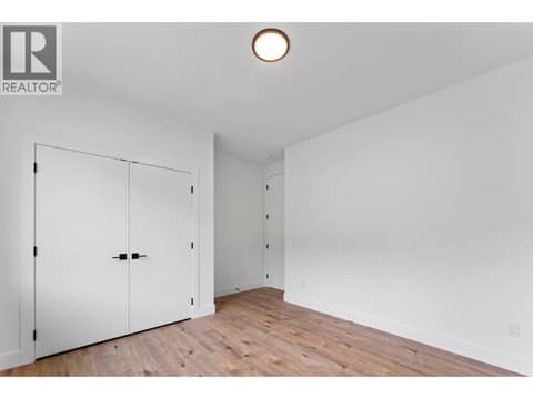 Main-floor bedroom at 2871 Copper Ridge Drive, Smith Creek, West Kelowna