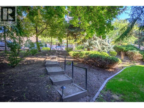 Rear street parking and lovely pathway to the building! at 3609 30 Avenue Unit# 208, City of Vernon
