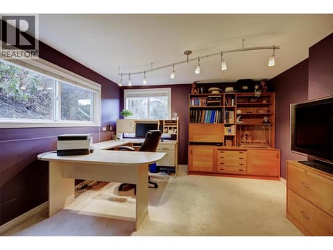 2nd bedroom on lower level, windows facing rear of property at 391 Braeloch Road, Upper Mission, Kelowna