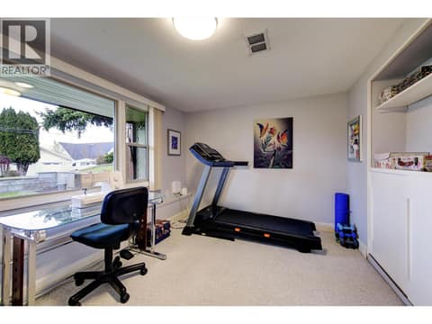 Den with loads of natural light facing the front yard at 391 Braeloch Road, Upper Mission, Kelowna