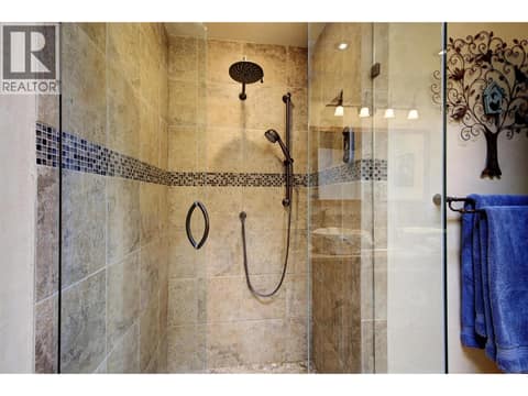 Dual head walk in shower with custom tile and glass at 391 Braeloch Road, Upper Mission, Kelowna