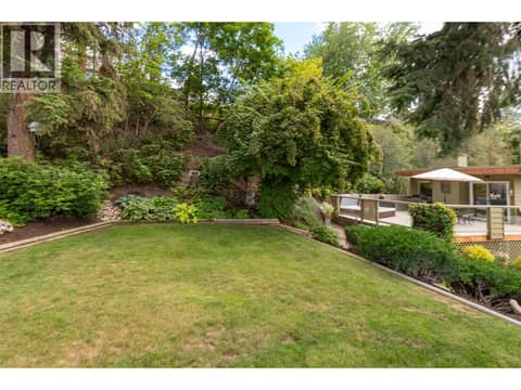 Lawn on the left side of the property at 391 Braeloch Road, Upper Mission, Kelowna