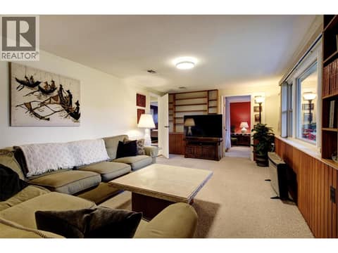 Lower level family room with large window facing front yard. Perfect for a rec room or media room at 391 Braeloch Road, Upper Mission, Kelowna