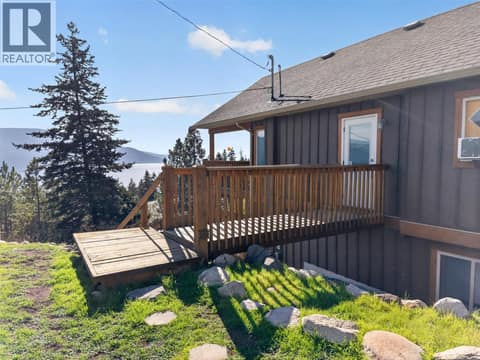 Additional entrance leads out to the side yard at 10375 Westshore Road, Okanagan North, Vernon