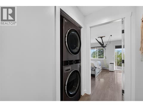 Laundry near the primary bedroom at 10375 Westshore Road, Okanagan North, Vernon