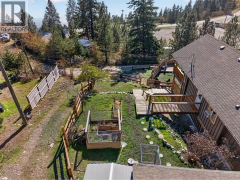 Yard to the side is perfect for the pets/gardening at 10375 Westshore Road, Okanagan North, Vernon