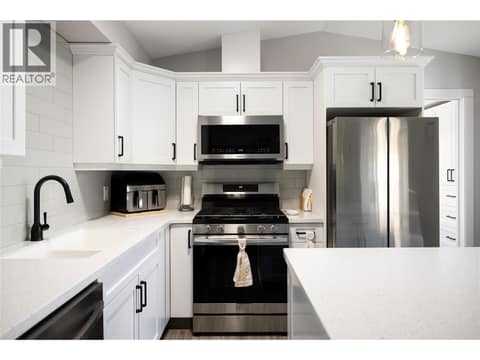 Stainless appliances, propane stove at 8000 Highland Road Unit# 48, North BX, Vernon