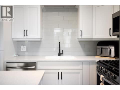 Subway tile backsplash, hard surface counters at 8000 Highland Road Unit# 48, North BX, Vernon